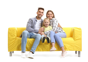 Sticker - Happy young family sitting on sofa against white background