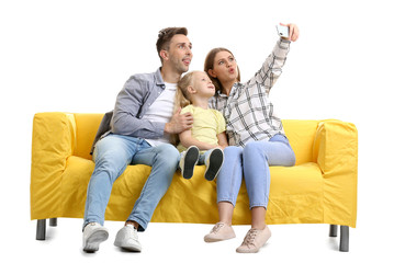 Sticker - Happy young family taking selfie on sofa against white background