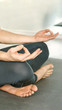 © elenavolf - Yoga calm pose. Lotus asana studio training. Man seated at mat. Beginner class