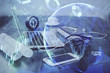 © peshkova - Stock market chart hologram drawn on personal computer background. Multi exposure. Concept of investment.