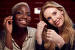 © Monkey Business - Two Young Female Friends Doing Make Up Reflected In Mirror Of Bathroom In Club