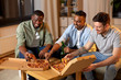 © Syda Productions - friendship, food and people concept - happy male friends drinking beer and eating pizza at home
