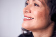 © Monkey Business - Close Up On Face Of Smiling Mature Woman In Studio