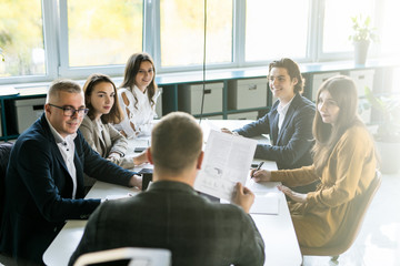 Businesspeople discussing together in conference room during meeting at office. Team work