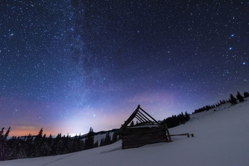 Wall Mural - a bright starry night in the mountains with the milky way in the sky, venus and millions of stars hi