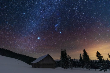 Wall Mural - a bright starry night in the mountains with the milky way in the sky, venus and millions of stars hi