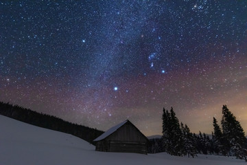 Wall Mural - a bright starry night in the mountains with the milky way in the sky, venus and millions of stars hi