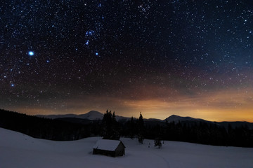 Wall Mural - a bright starry night in the mountains with the milky way in the sky, venus and millions of stars hi