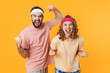 © Drobot Dean - Portrait of athletic young couple screaming and clenching fists in triumph