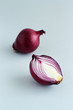 Purple onion on a light grey background