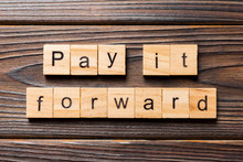 Pay It Forward Word Written On Wood Block. Pay It Forward Text On Wooden Table For Your Desing, Concept