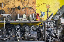 Close-up Of An Array Of Used Rusty And Oily Engine Parts And Various Tools In A Auto Junk And Repair Shop In Iloilo City, Philippines, Asia