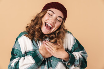 Canvas Print - Photo of pretty excited woman holding her hands on chest and laughing