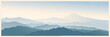 Mountain morning landscape panoramic type with the silhouettes of the mountains against the dawn