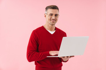 Poster - Mature man using laptop computer.