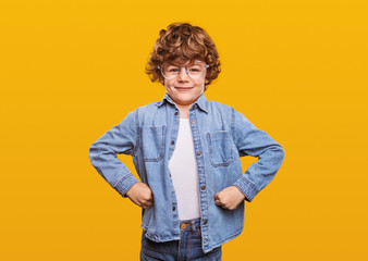 strong little wunderkind flexing muscles