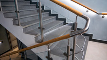 Stainless Steel, Glass And Wood Railing.Fall Protection. Modern Design Of Handrail And Staircase