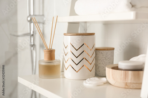 Cuadros en Lienzo Shelving unit with different items in bathroom interior