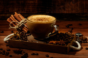 Wall Mural - Cup of coffe Cappuccino  with milk on a dark background. Hot coffe ,latte or Cappuccino prepared with milk on a wooden table with copy space.