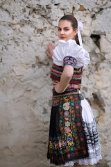 Beautiful slovak woman in traditional costume. Slovak folklore.