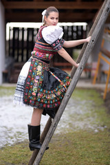 Beautiful slovak woman in traditional costume. Slovak folklore.