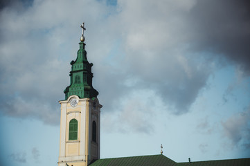 Church tower with cloudy sky in the background