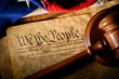 The American constitution, a gavel, and the United States flag