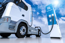 Hydrogen Logo On Gas Stations Fuel Dispenser. H2 Combustion Truck Engine For Emission Free Ecofriendly Transport.