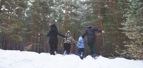 family in winter forest