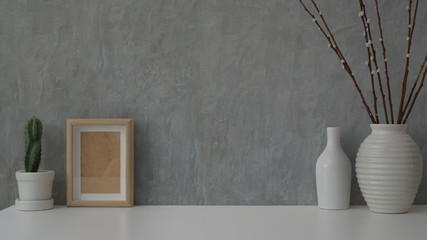 Wall Mural - Close up view of minimal workspace on white table with grey loft wall