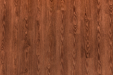 Natural dark brown wooden surface floor texture background.  polished  laminate  parquet