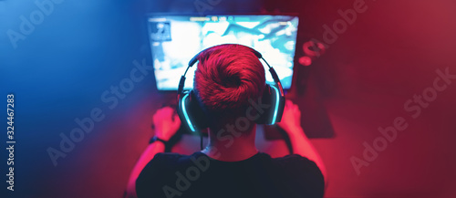 Fotografía Blurred background professional gamer playing tournaments online games computer