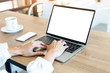© panitan - mockup image blank screen computer,cell phone with white background for advertising text,hand man using laptop texting mobile contact business search information on desk in office.marketing,design