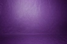 Studio Background, Backdrop Wall And Floor. Background Studio Portrait Backdrops Painted Canvas Or Fabric For Use With Portraits, Products And Concepts. Light Spot On A Purple Fabric Background.