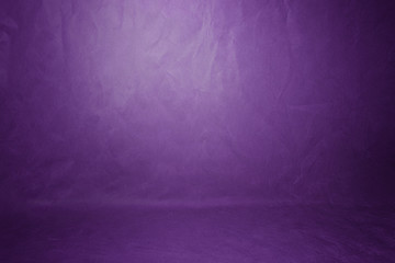 Wall Mural - Studio background, backdrop wall and floor. Background Studio Portrait Backdrops painted canvas or fabric for use with portraits, products and concepts. Light spot on a purple fabric background.