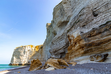 Rocks on the coast of the English channel strait. Etretat village, Normandy region, France.