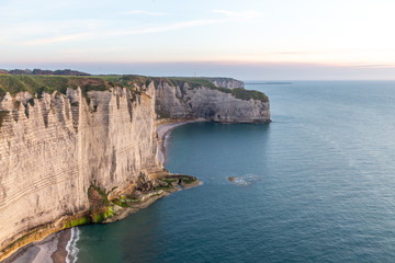 Wall Mural - Rocks on the coast of the English channel strait. Etretat village, Normandy region, France.