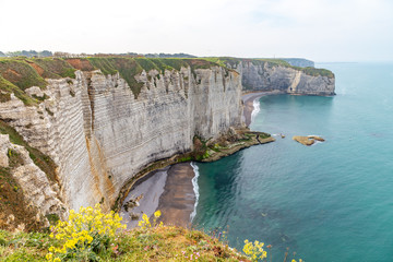 Wall Mural - Rocks on the coast of the English channel strait. Etretat village, Normandy region, France.