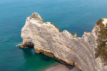 Wall Mural - Rocks on the coast of the English channel strait. Etretat village, Normandy region, France.