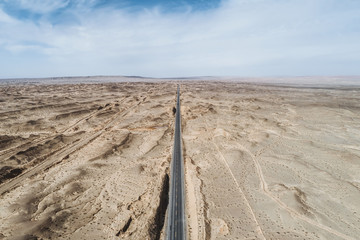 Wall Mural - aerial view of desert road in northwest of China