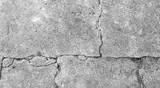 Fototapeta Desenie - Black and white texture background floor of caraked cement garage.