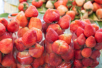 Red fresh strawberry Packed in a plastic bag for sale.