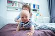 © Coolpicture - Cute baby with mother at home