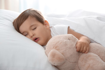 Sticker - Cute little baby sleeping with toy at home. Bedtime