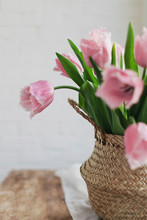 Pink Tulips At Home On A Wooden Table