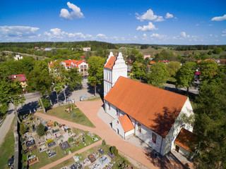 Poster - Aerial view of beautiful Assumption of Blessed Mary Virgin Church in Kruklanki, Poland (former Kruglanken, East Prussia)