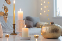Home Decor With Golden Pumpkin And Burning Candles