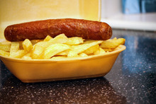 Sausage And Chips From A Takeaway