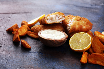 Wall Mural - traditional British fish and chips consisting of fried fish, potato chips and mayonnaise