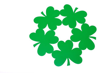 St Patrick's Day background of green clovers in a pattern on white background